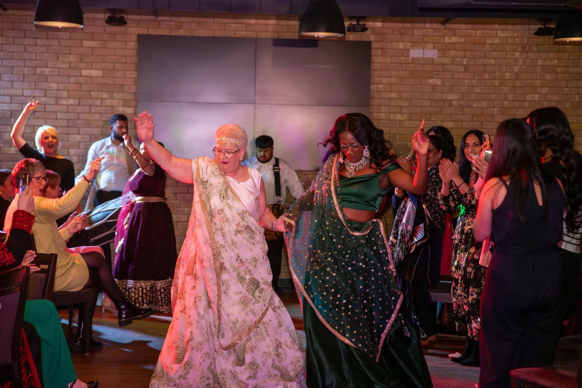 Models and guests dancing together at the Molineux fashion show